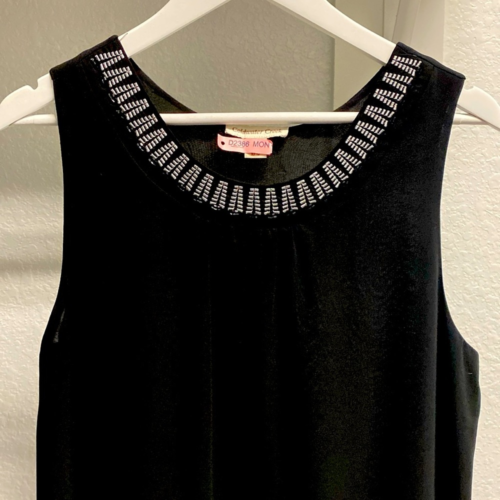 Sleeveless black blouse